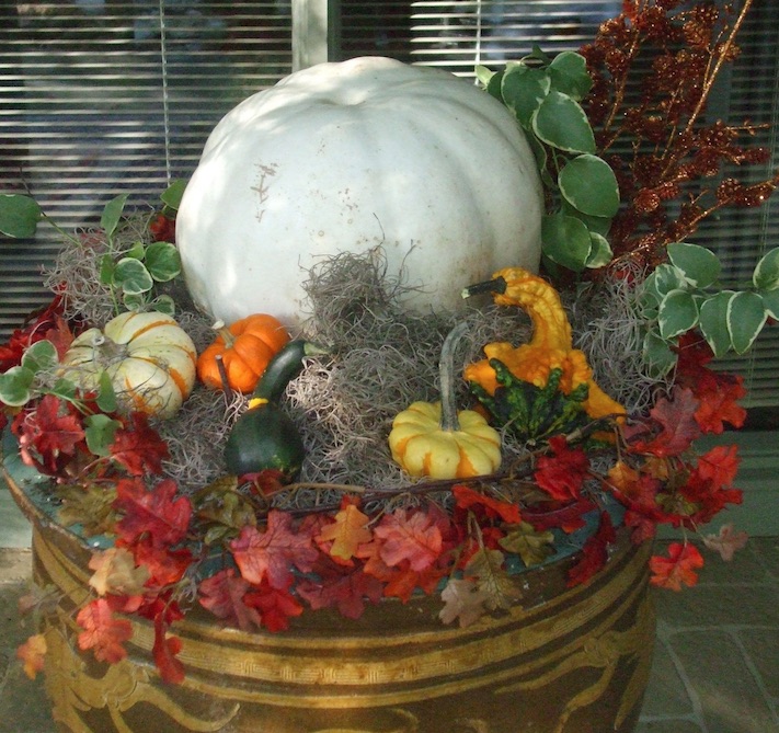 White pumpkins, a selection o minis and faux leaves adorn an urn for a beautiful fall planting. (C) Jo Ellen Meyers Sharp