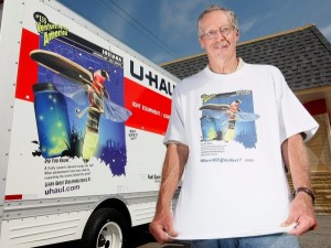 Purdue entomologist Tom Turpin models t-shirt fashioned after firefly image on U-Haul truck. Photo courtesy U-Haul.