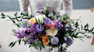 Lisianthus, scabiosa, fragrant garden roses, stock, Queen Anne's lace, vines and branches add to the lush, natural feel of JP Parker Flowers’ American Garden style bouquet. Photo courtesy JP Parker Flowers 