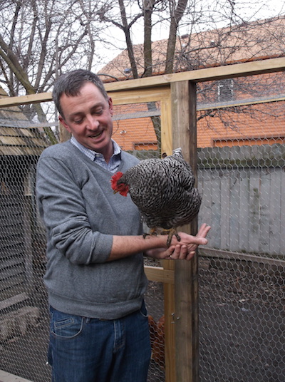 Chris Turner, who has been keeping chickens for three years, gives Hula, a Barred Rock chicken, her 15 minutes of fame. © Jo Ellen Meyers Sharp 